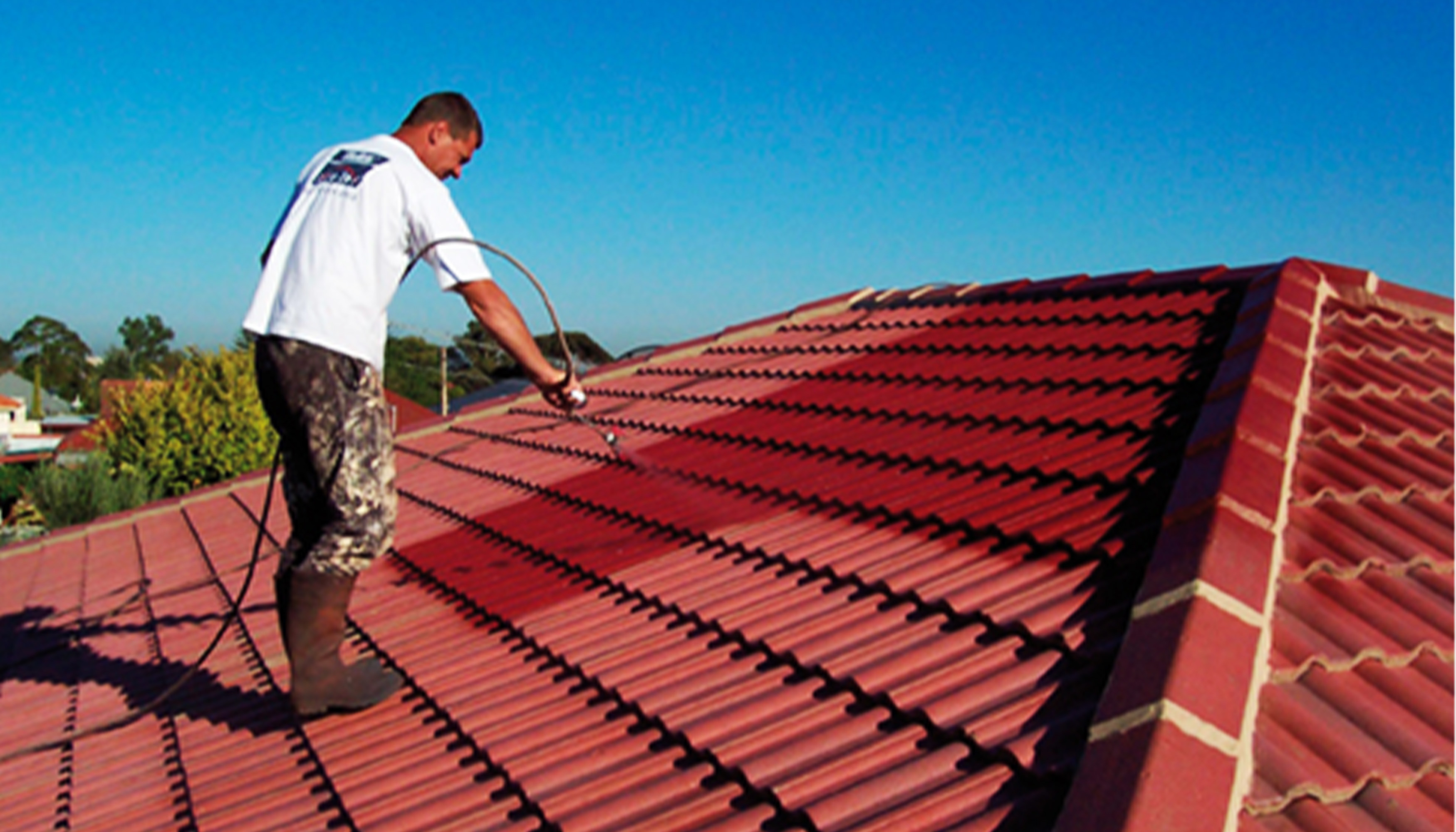 workers painting a roof